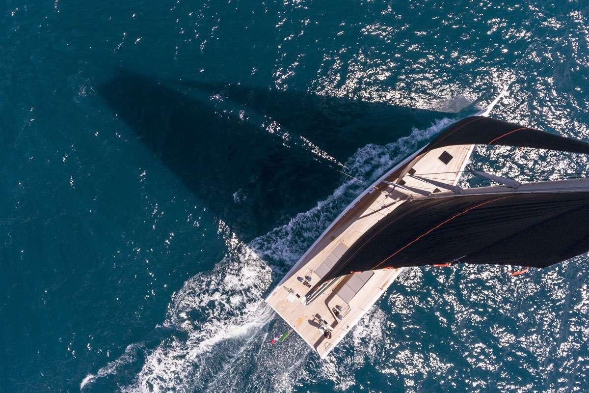 a space shuttle flying over earth aboard KARMA Yacht for Charter