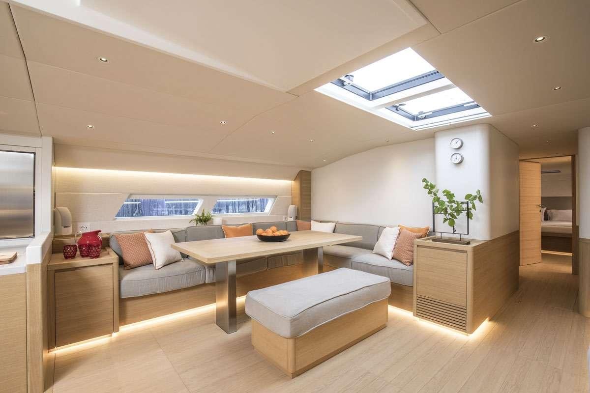a living room with a couch and a table aboard KARMA Yacht for Charter