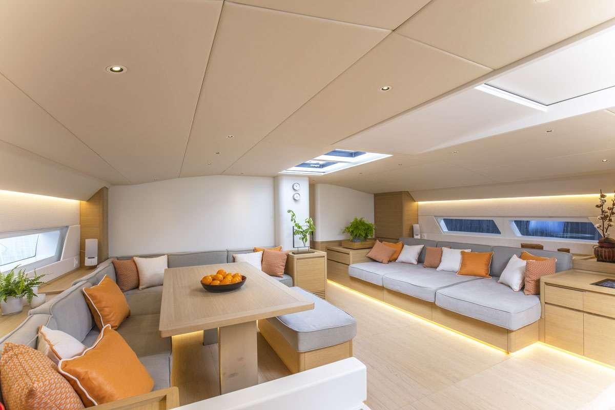 a living room with a couch and a table aboard KARMA Yacht for Charter