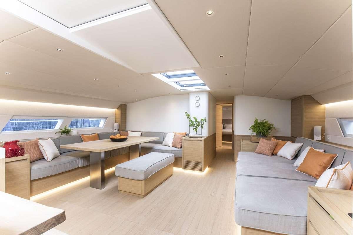 a living room with a couch and a table aboard KARMA Yacht for Charter