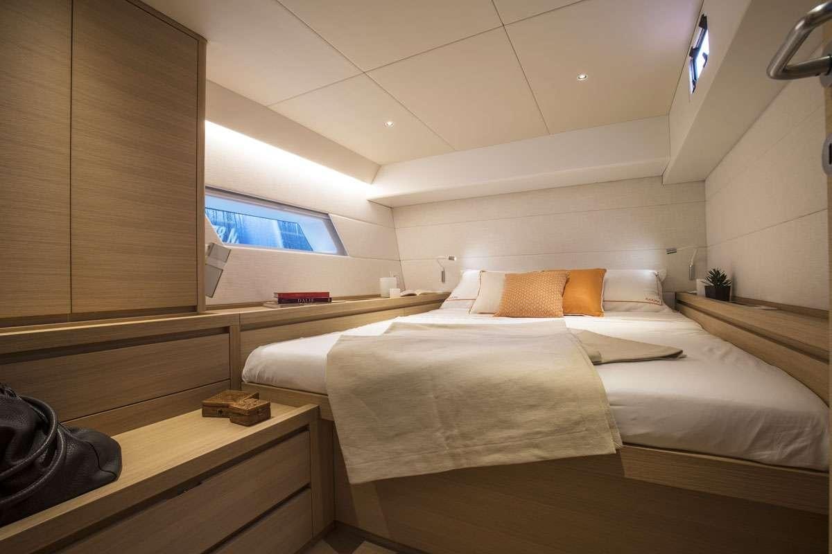 a room with two beds aboard KARMA Yacht for Charter