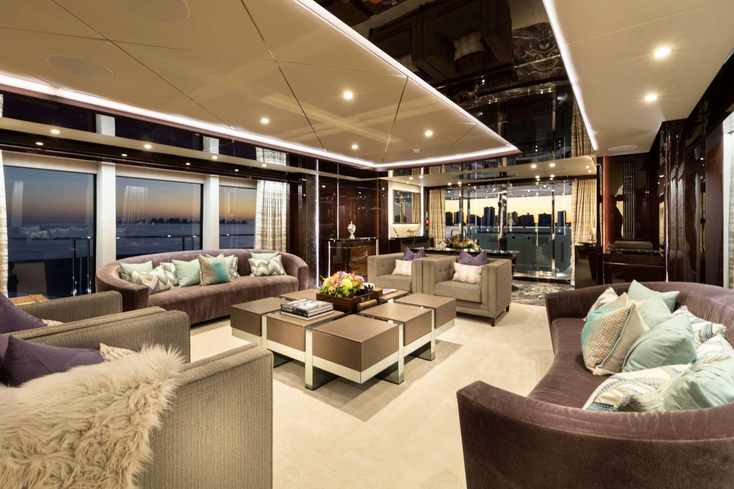 a living room with a large window aboard EXODUS Yacht for Charter