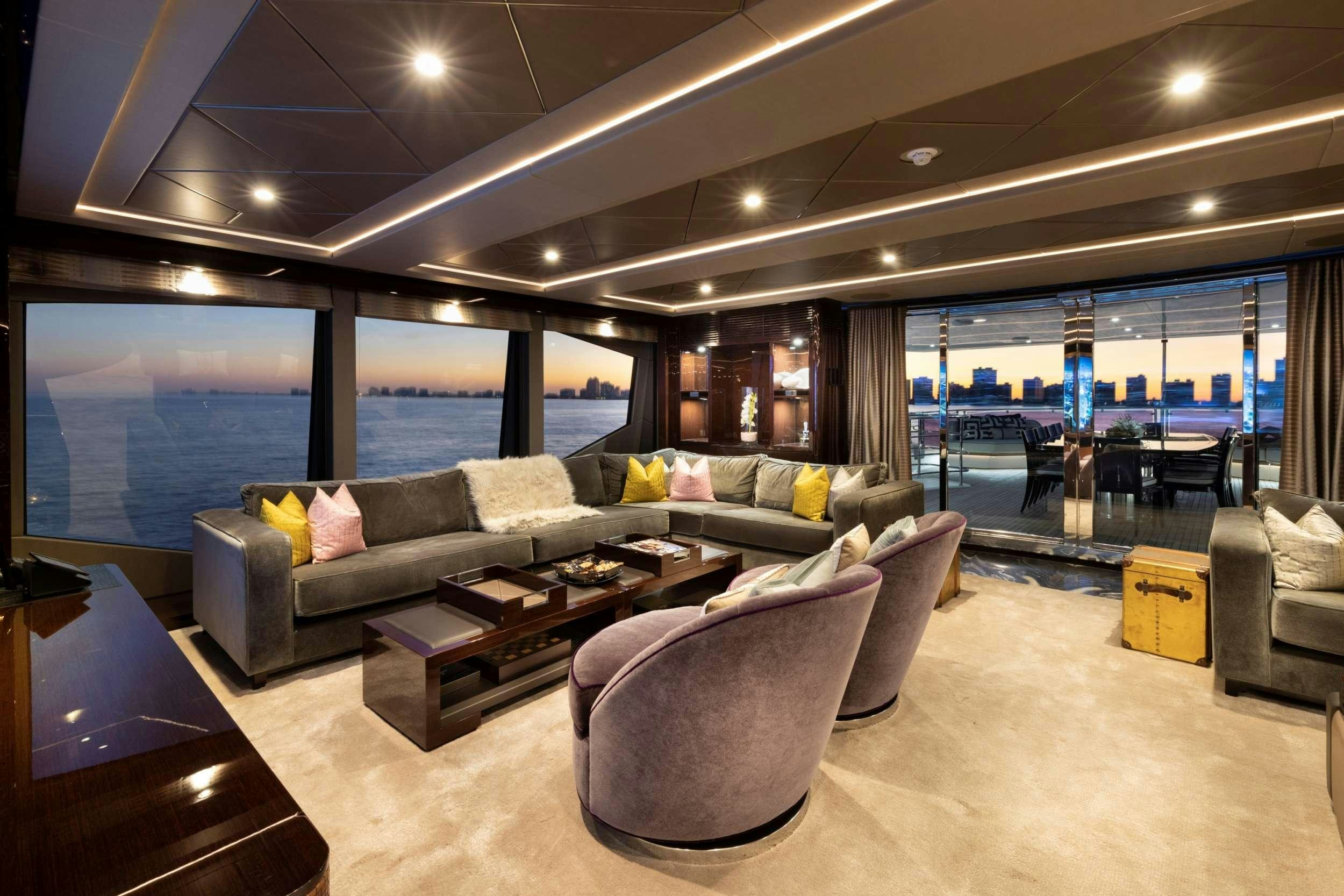 a living room with a large window aboard EXODUS Yacht for Charter