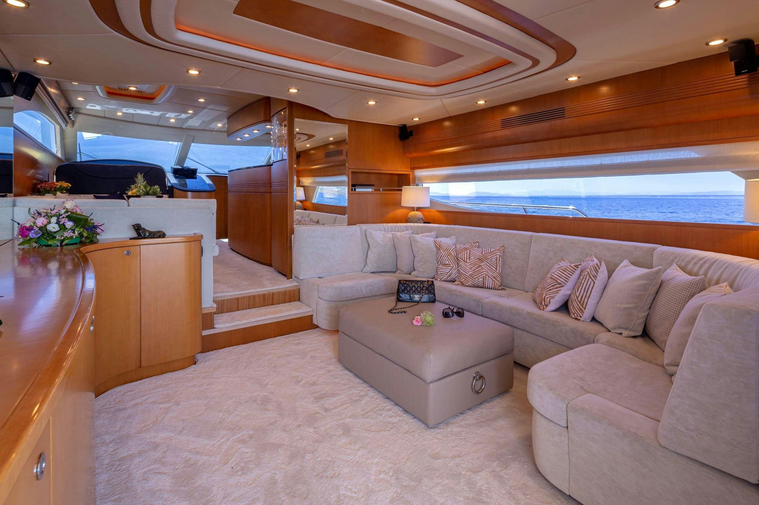a living room with a large window aboard LEGEND Yacht for Charter