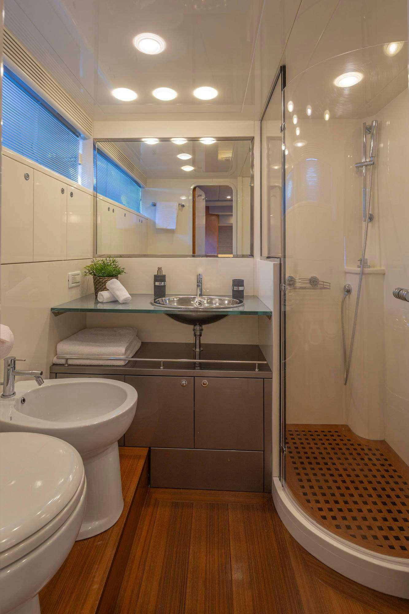 a bathroom with a sink and a mirror aboard LEGEND Yacht for Charter