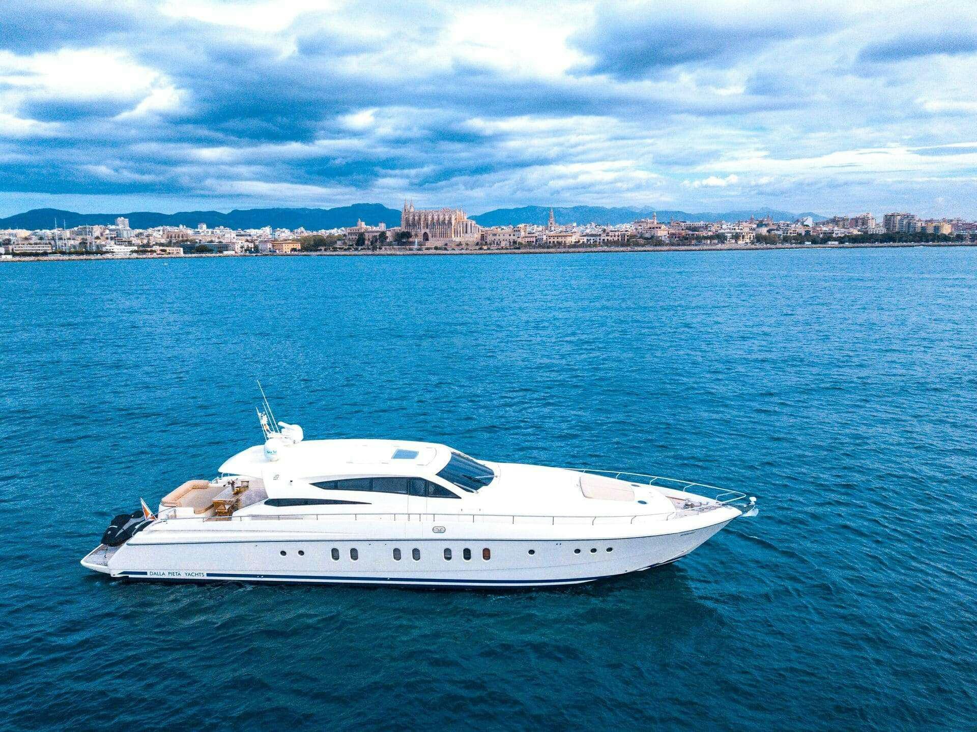 a white boat in the water aboard DOUBLE D Yacht for Charter