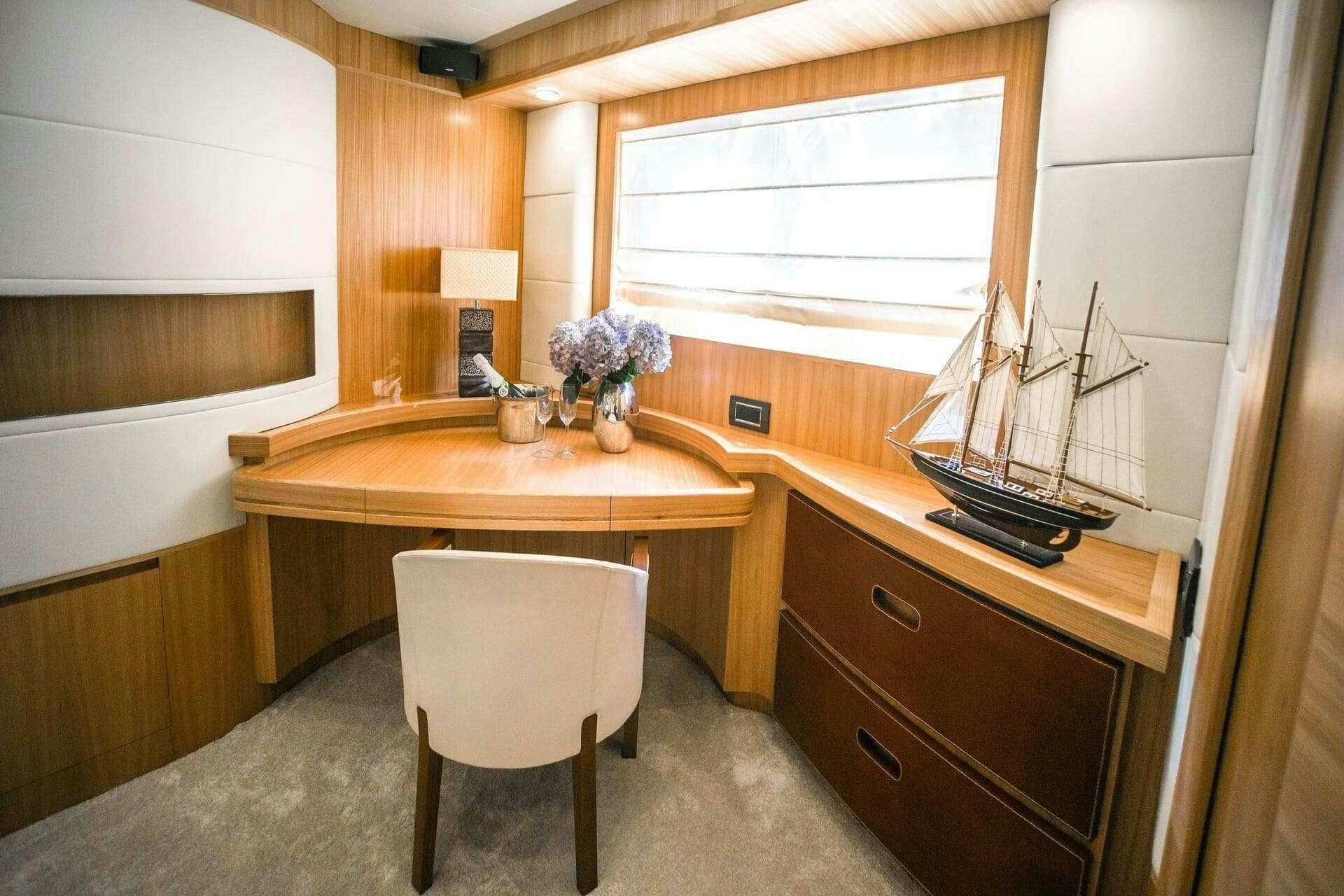 a kitchen with a table and chairs aboard DOUBLE D Yacht for Charter