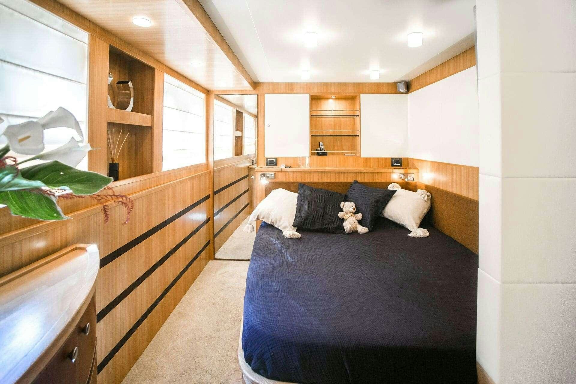 a bed with a dog on it aboard DOUBLE D Yacht for Charter
