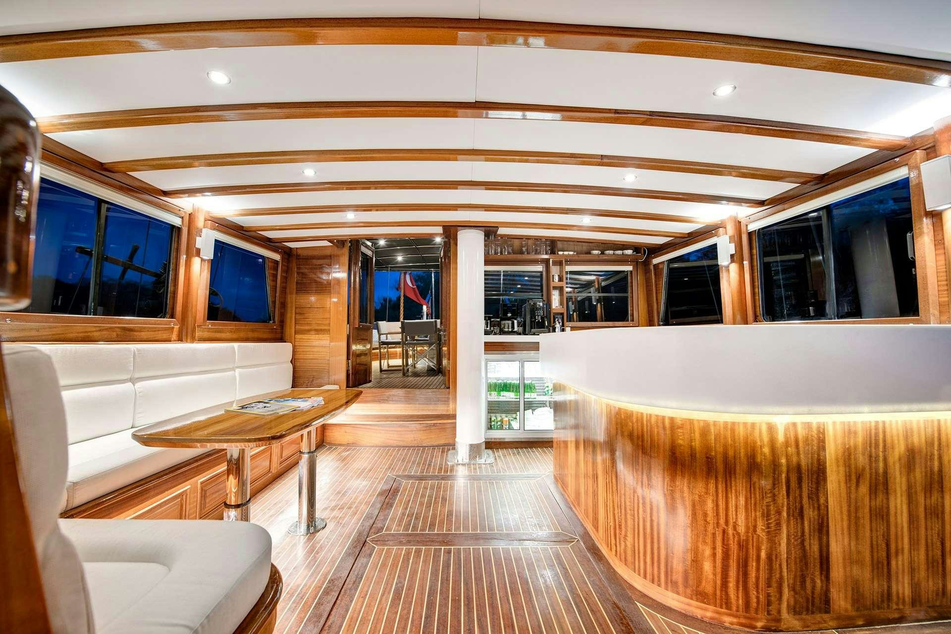 a room with a table and chairs aboard SERENAD A Yacht for Charter