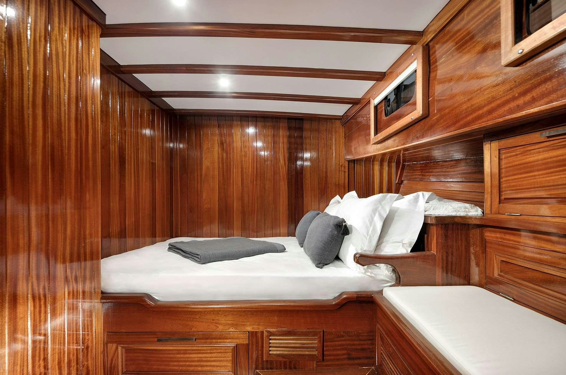 a room with wooden walls aboard SERENAD A Yacht for Charter