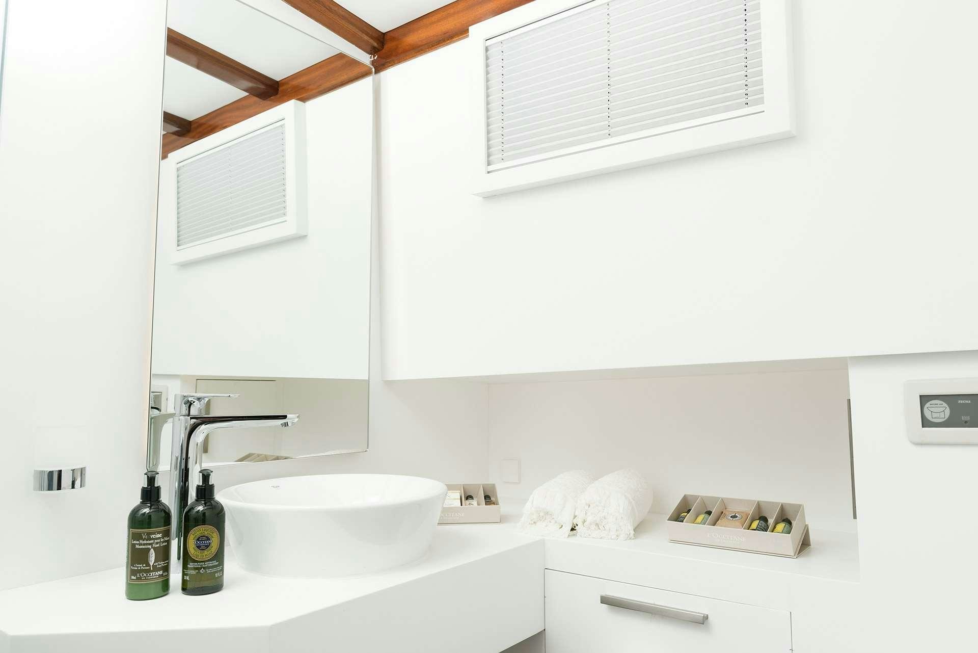 a sink and a window in a room aboard SERENAD A Yacht for Charter