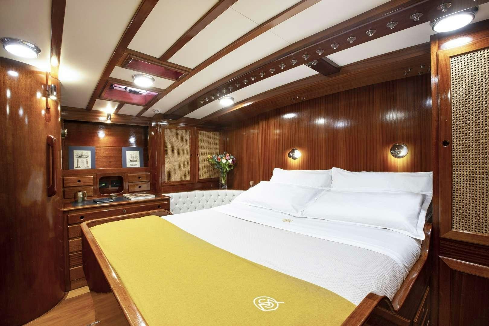 a bed in a room aboard QUARTA SANTA MARIA Yacht for Charter