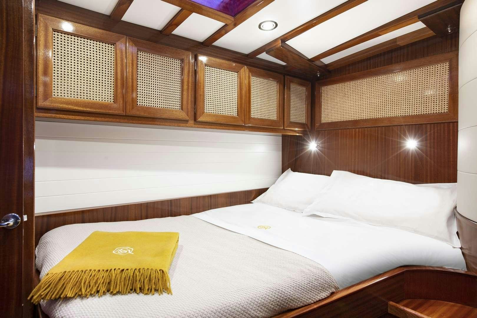 a room with two beds aboard QUARTA SANTA MARIA Yacht for Charter