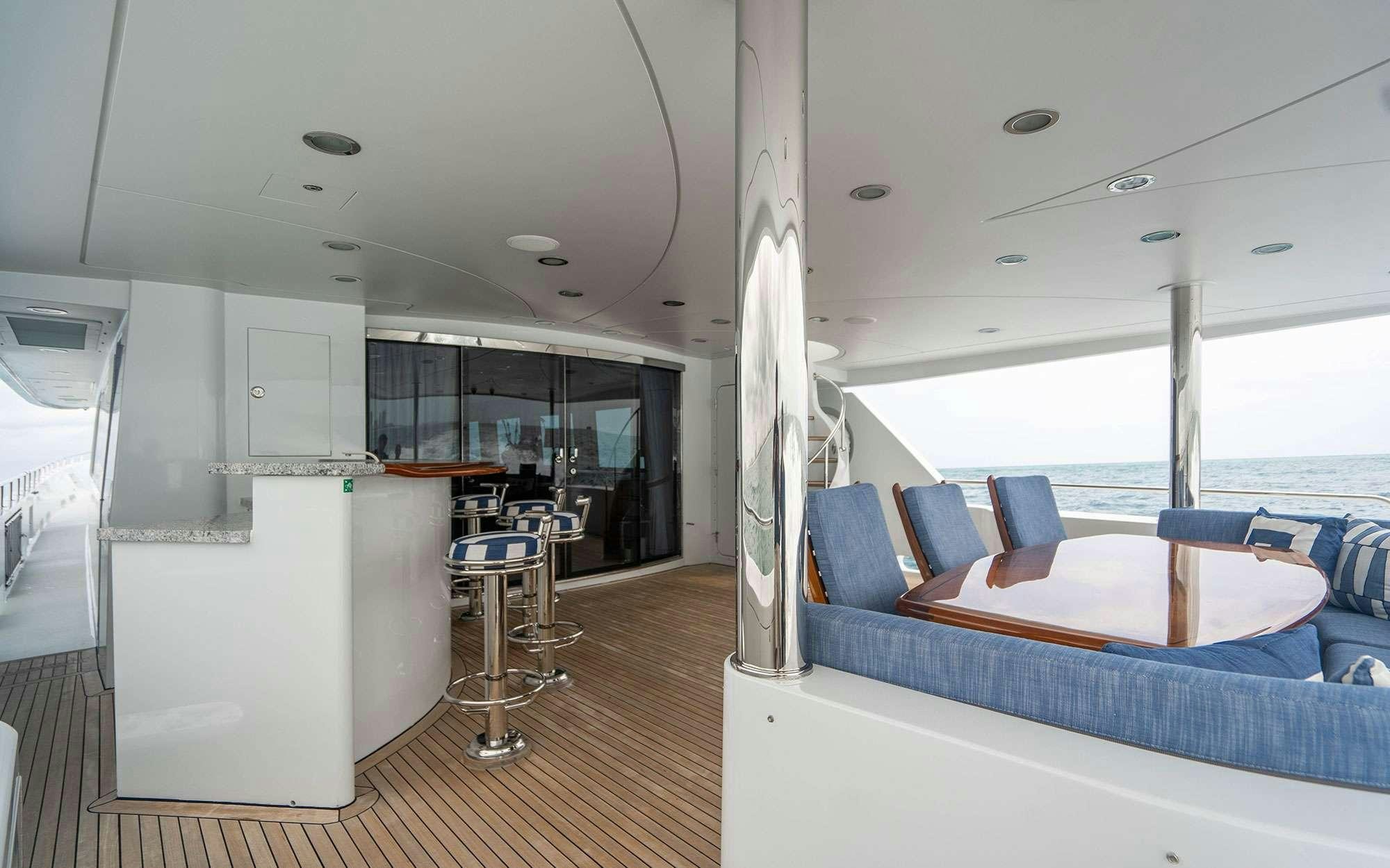 a room with a couch and a table aboard RISK & REWARD Yacht for Charter