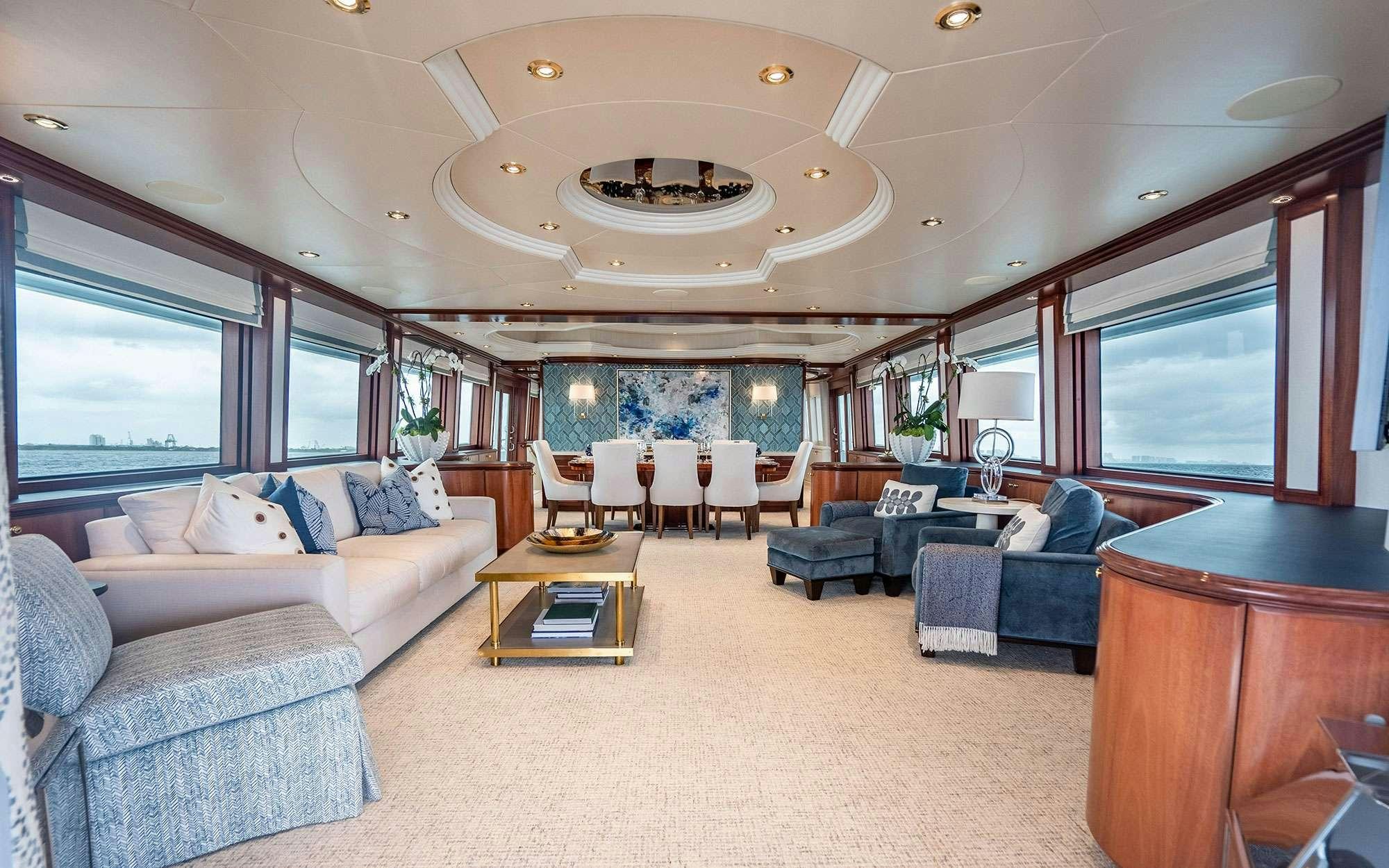 a large living room with a large open window aboard RISK & REWARD Yacht for Charter