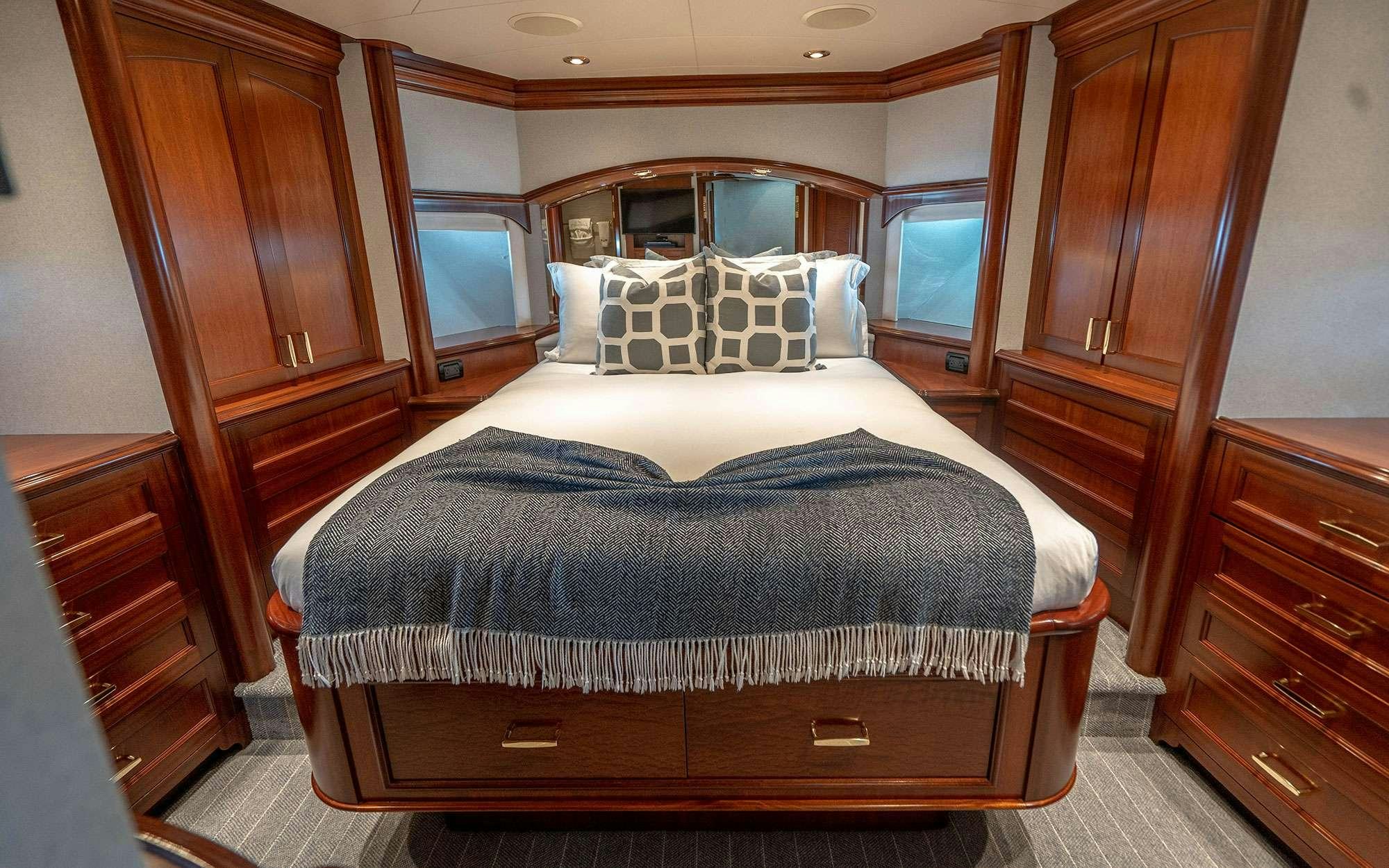 a bed in a room aboard RISK & REWARD Yacht for Charter