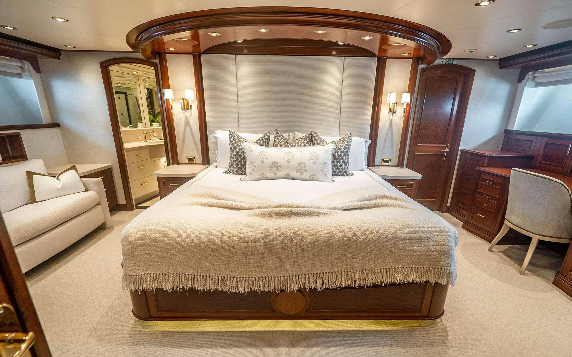 a bed in a room aboard RISK & REWARD Yacht for Charter