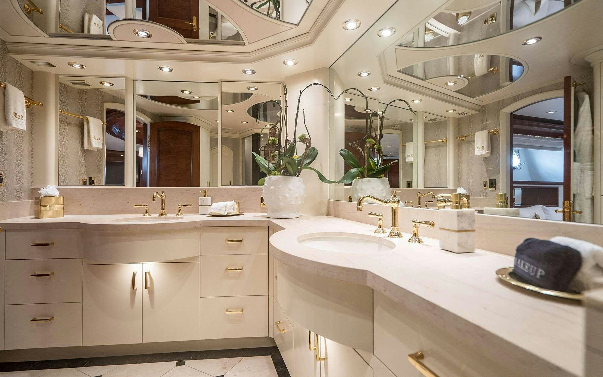 a bathroom with a large mirror aboard RISK & REWARD Yacht for Charter