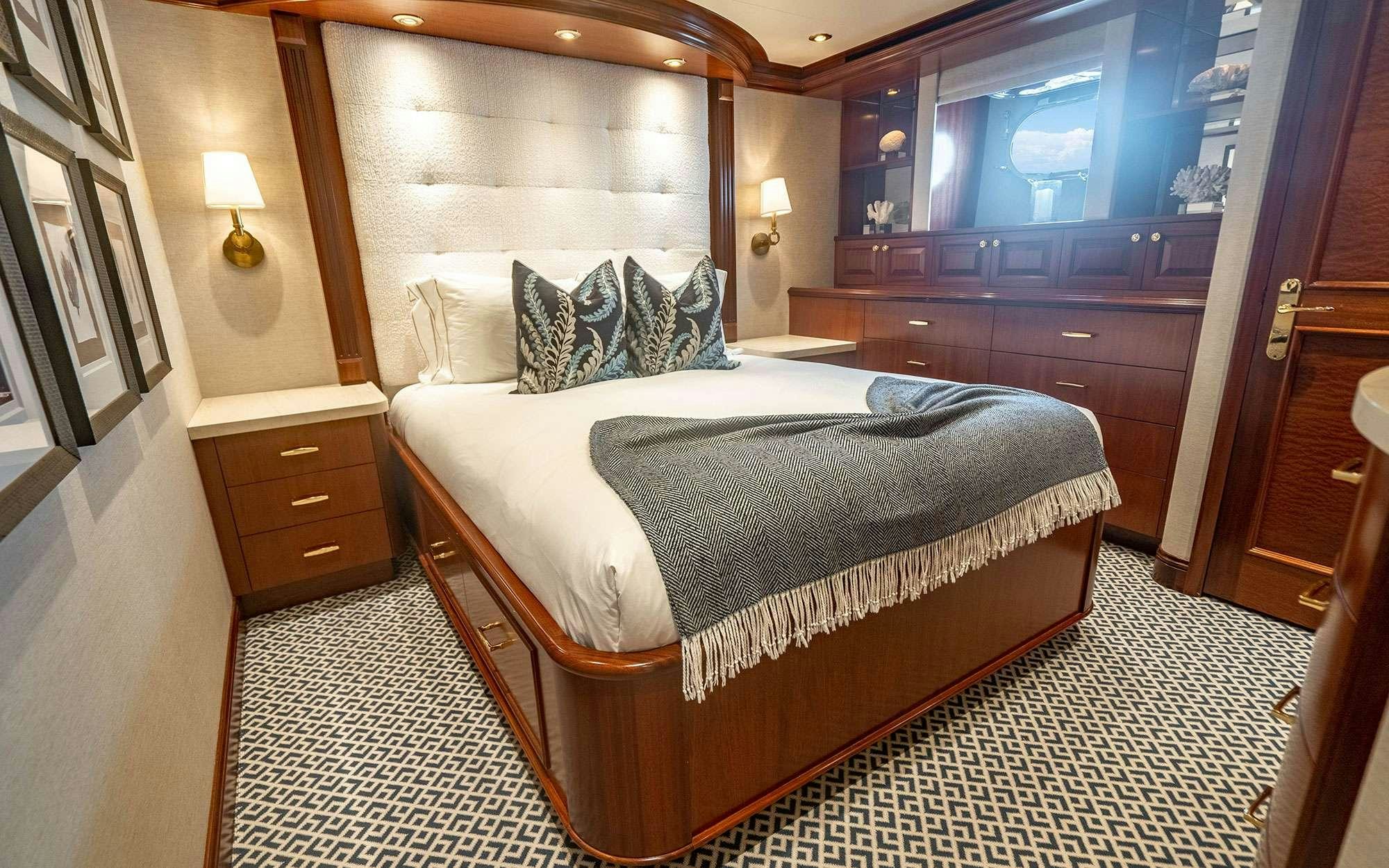 a bed in a room aboard RISK & REWARD Yacht for Charter