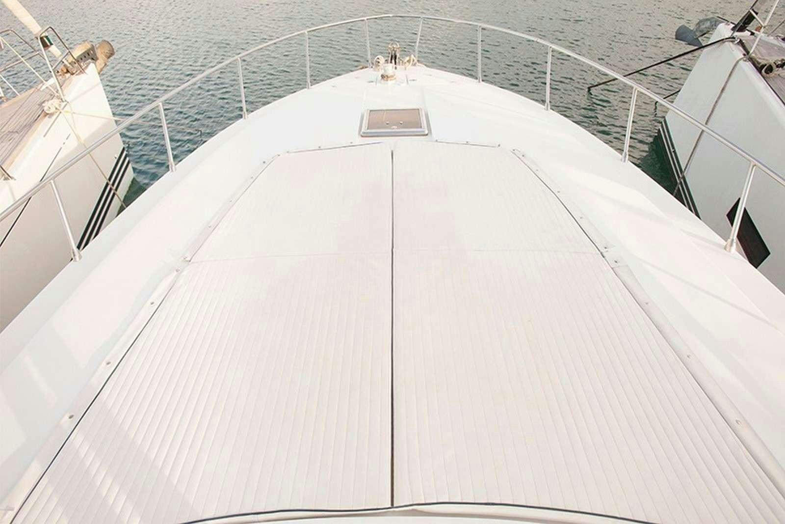 a white staircase with a railing aboard ARGENT'ARIA Yacht for Charter