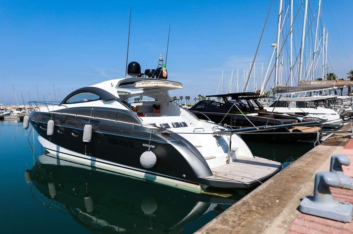 a boat docked at a pier aboard EVA II Yacht for Charter