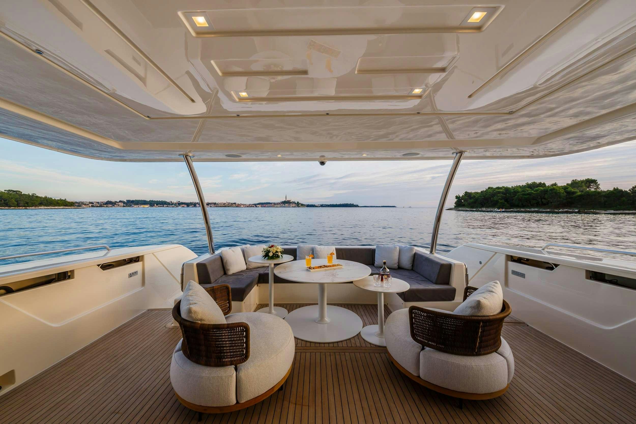 a room with a table and chairs aboard DAMARI Yacht for Charter