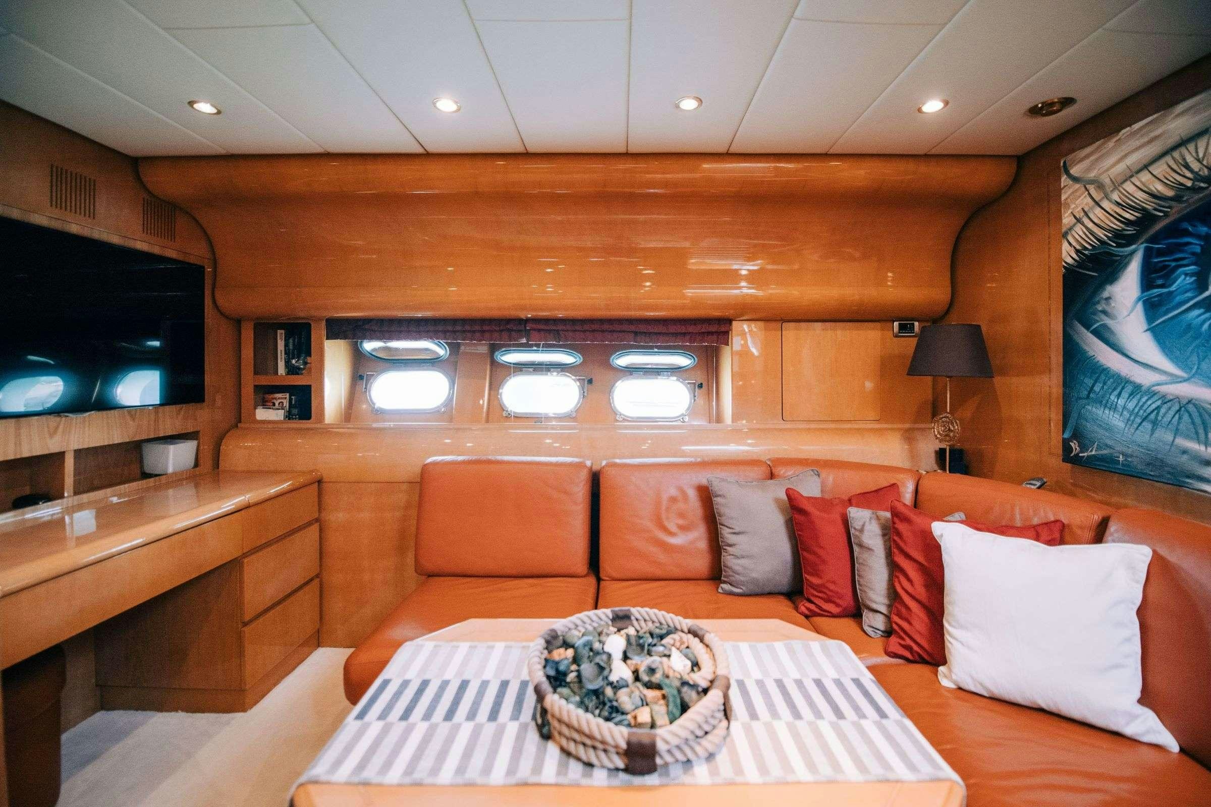 a living room with a couch and a table aboard ROMACHRIS II Yacht for Charter