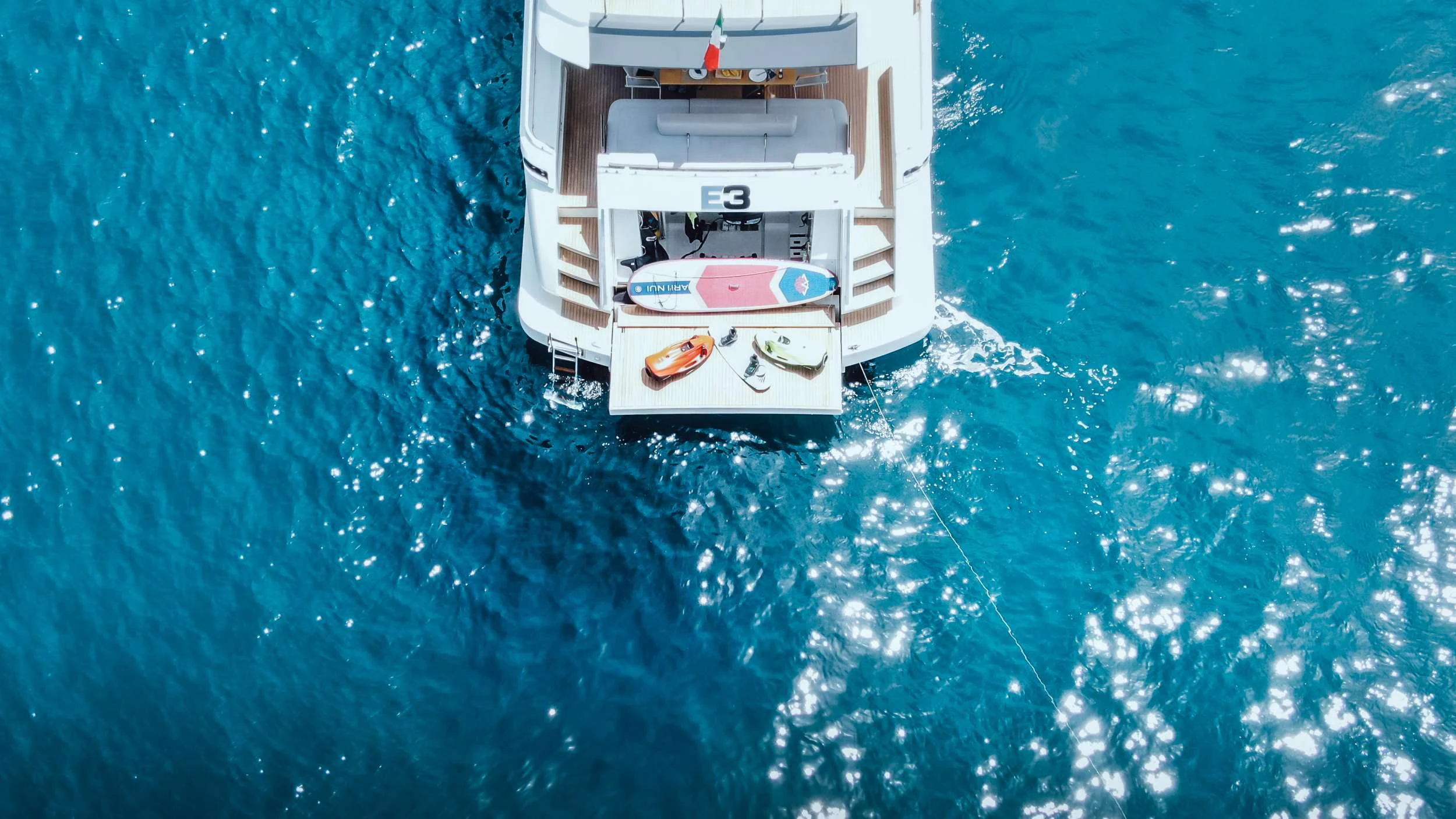 a white boat in the water aboard E3 Yacht for Charter