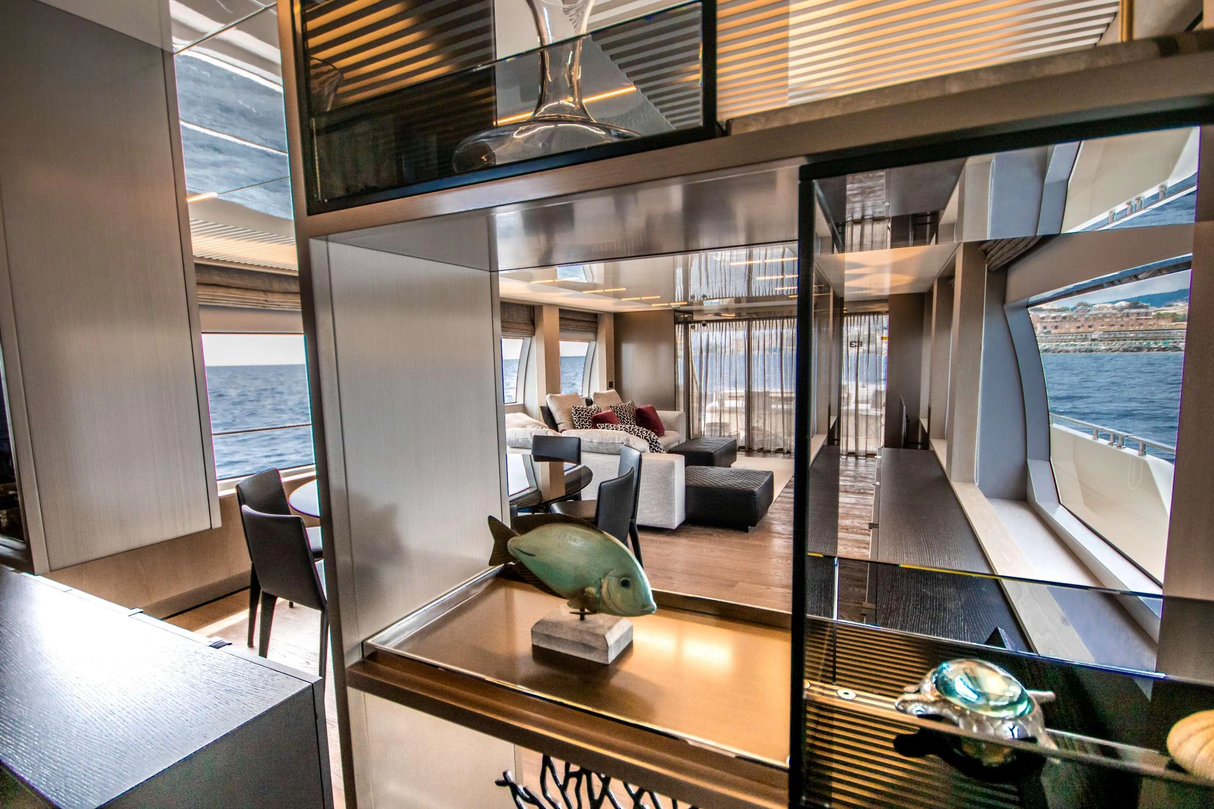 a room with a table and chairs aboard E3 Yacht for Charter