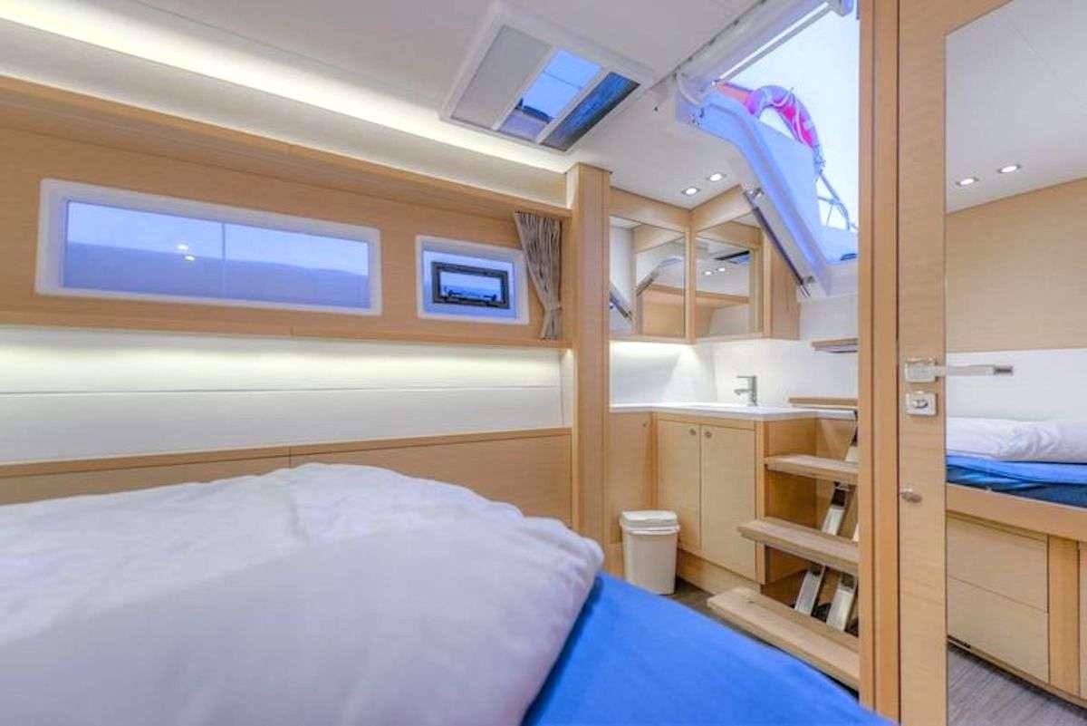 a bunk bed with a ladder aboard GEMMA Yacht for Charter
