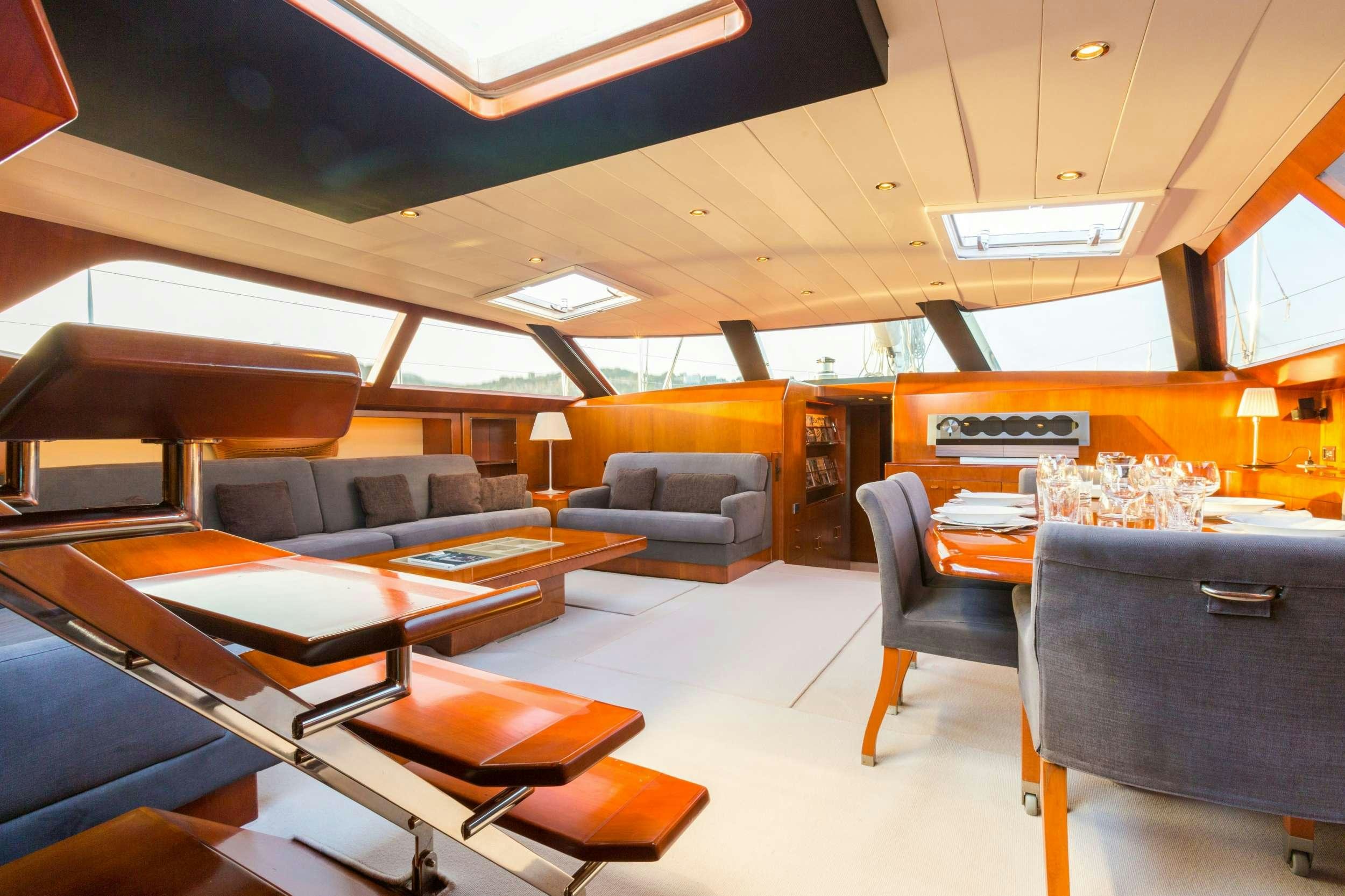 a room with a couch and a table aboard Free at Last Yacht for Charter