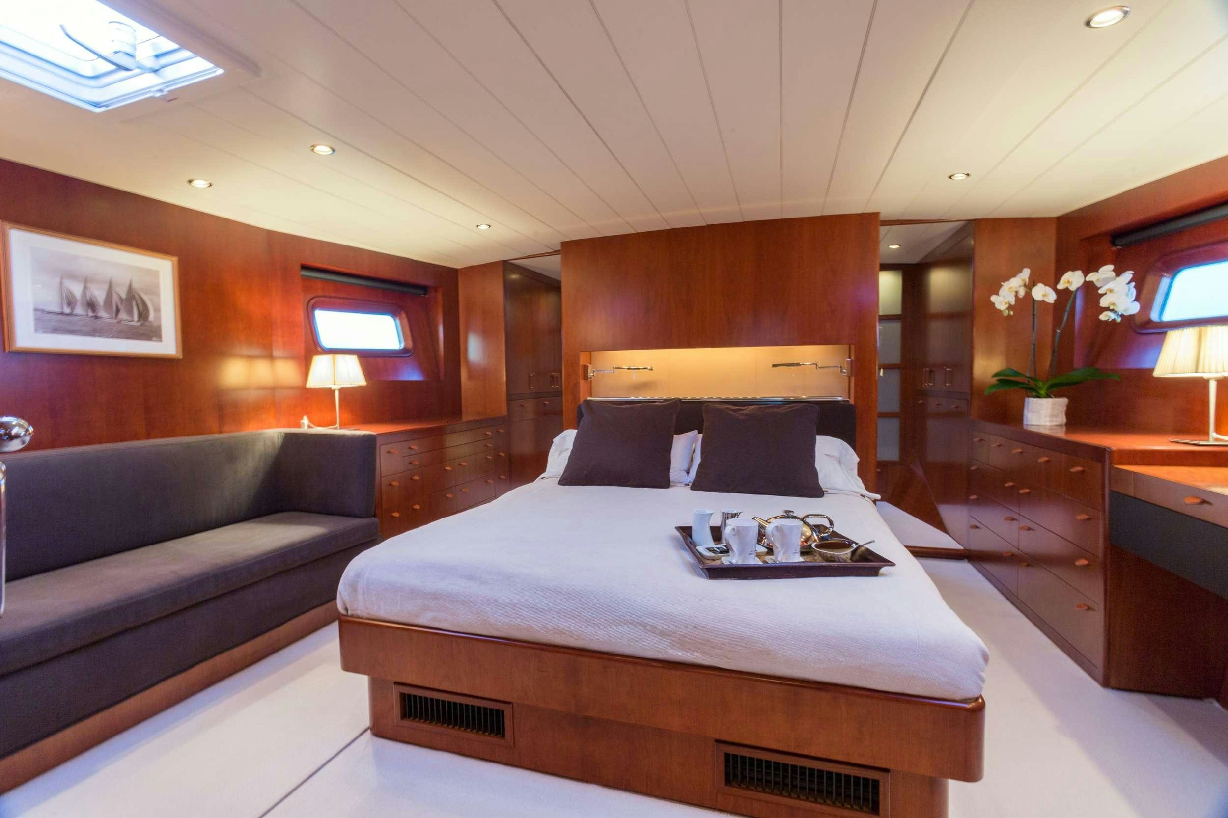 a bed in a hotel room aboard Free at Last Yacht for Charter