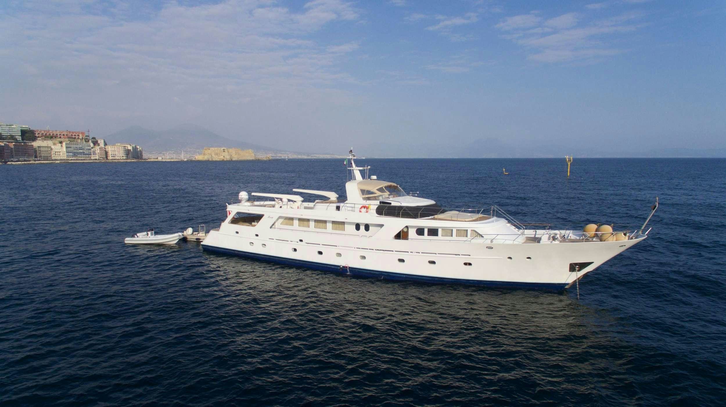 a large white yacht in the water aboard GITANES Yacht for Charter