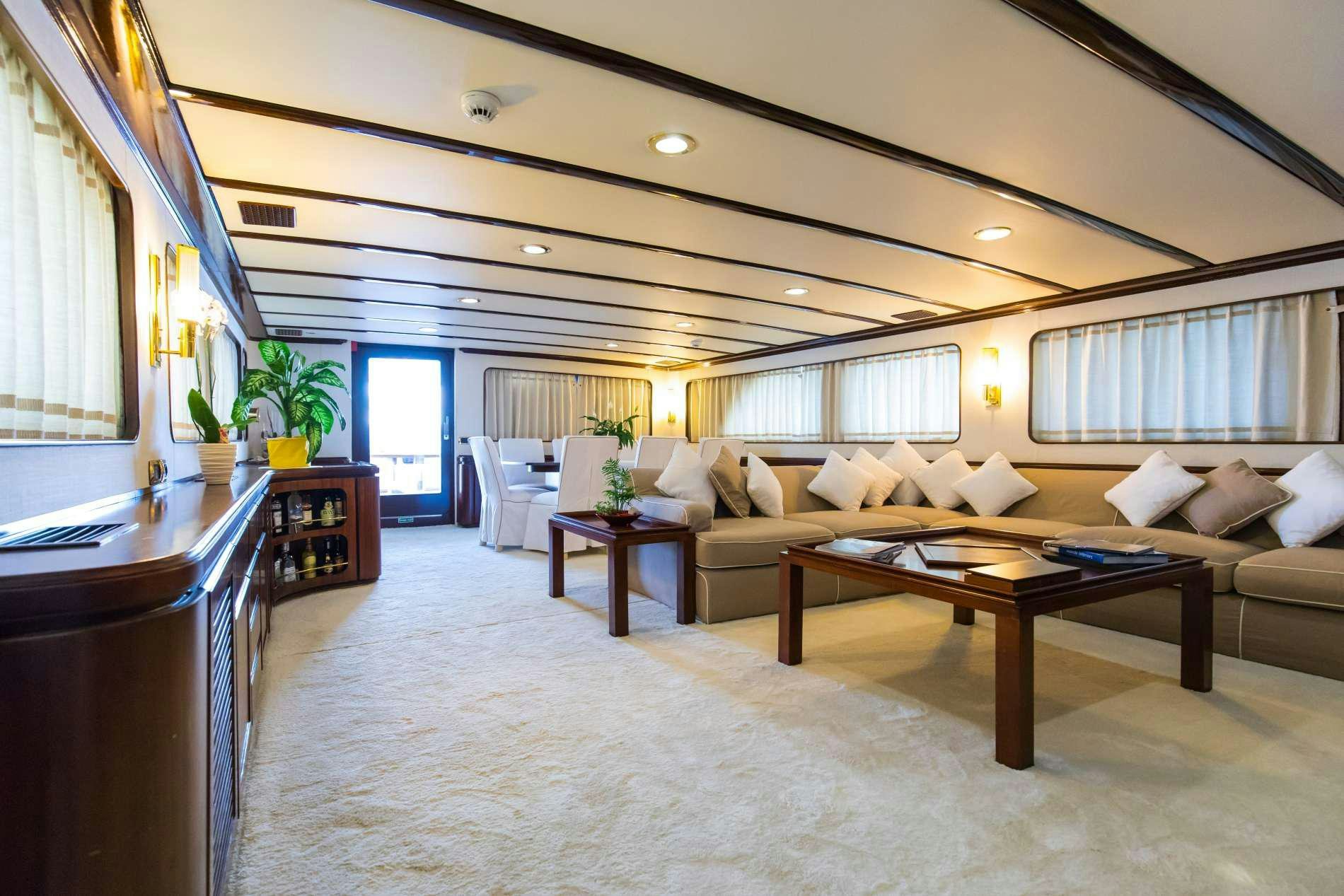 a living room with a couch and a coffee table aboard GITANES Yacht for Charter
