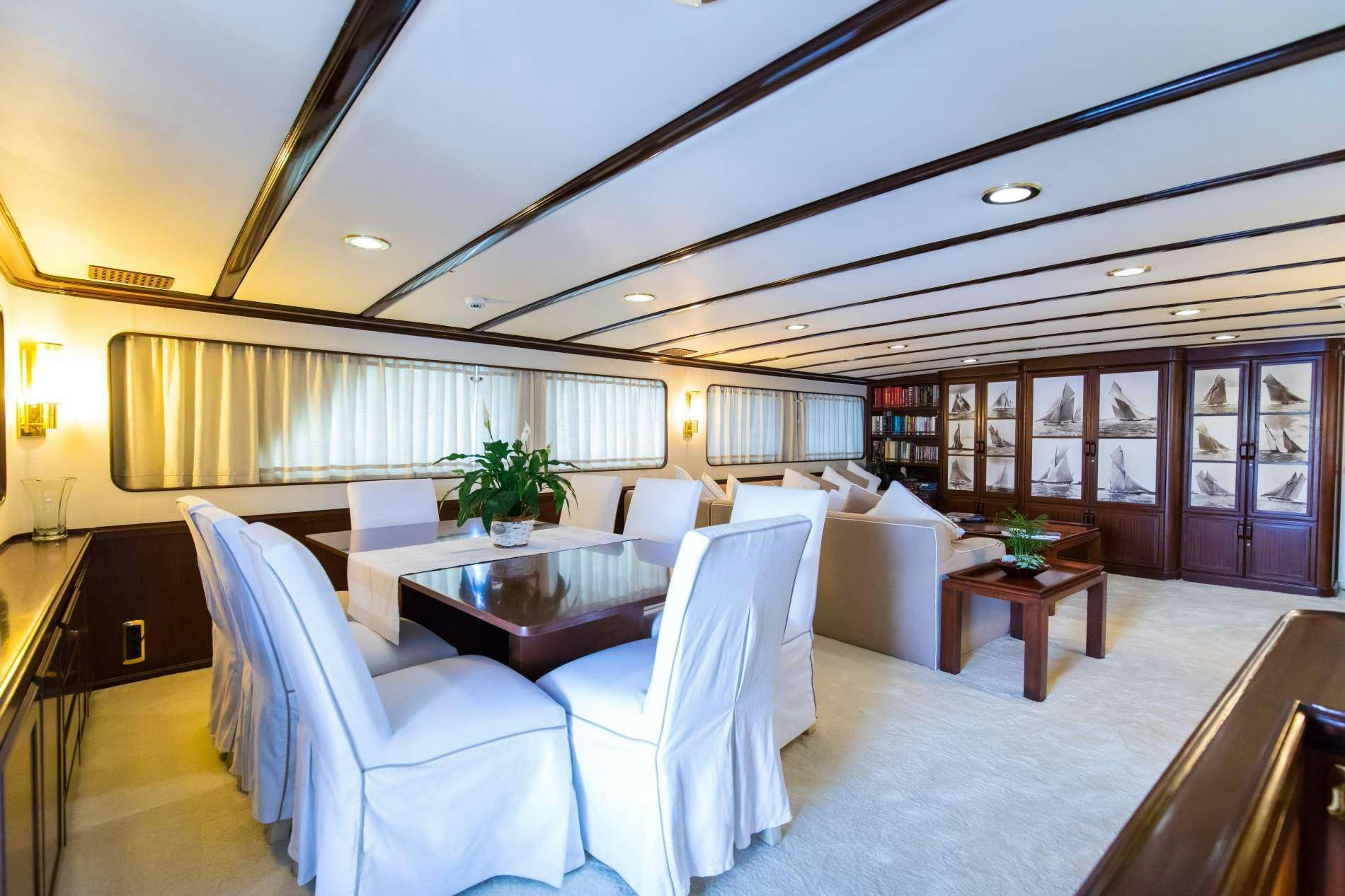 a room with a couch and a table aboard GITANES Yacht for Charter