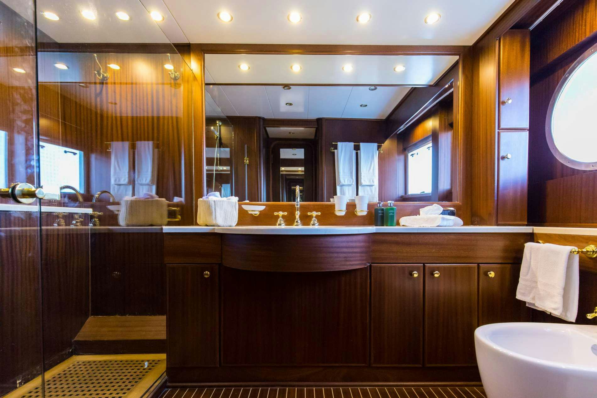 a bathroom with a large mirror aboard GITANES Yacht for Charter