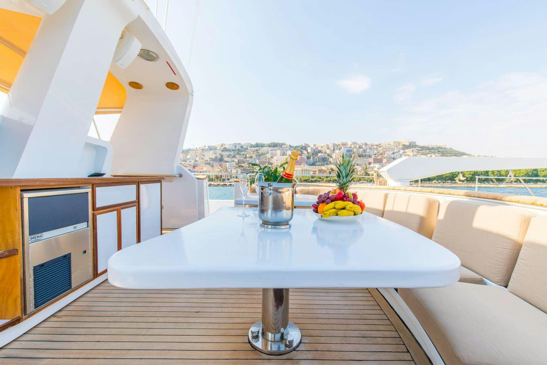 a table with a glass bowl on it aboard GITANES Yacht for Charter