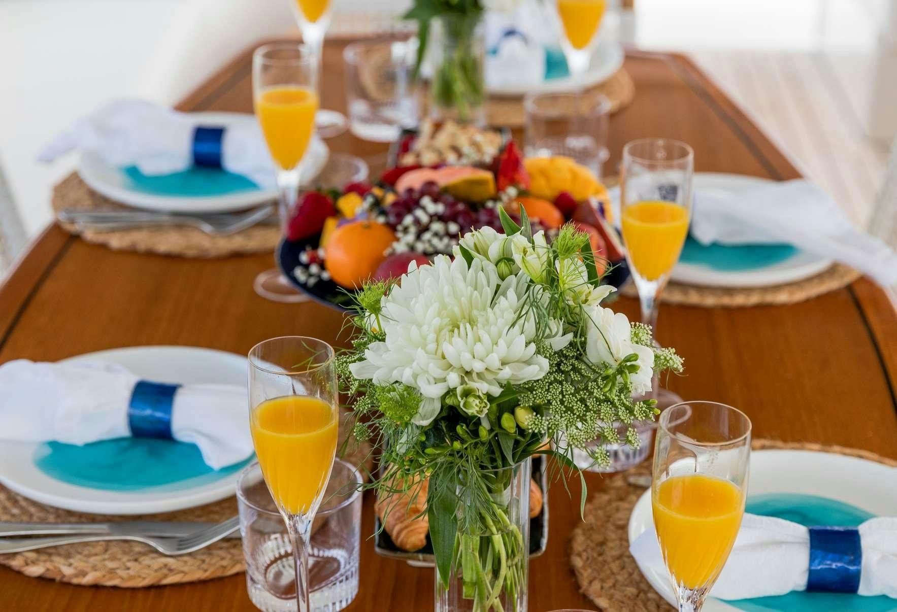 a table with food and drinks aboard TEXAS T Yacht for Charter