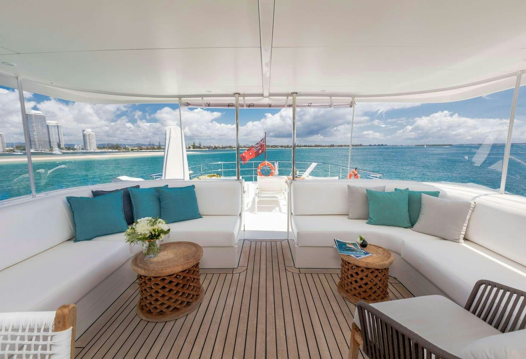 a room with a couch and a table and chairs aboard TEXAS T Yacht for Charter