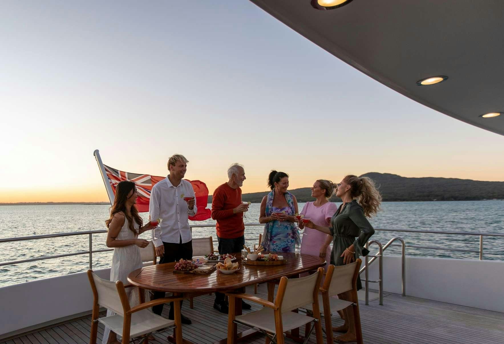 a group of people on a boat aboard PACIFIC MERMAID Yacht for Charter