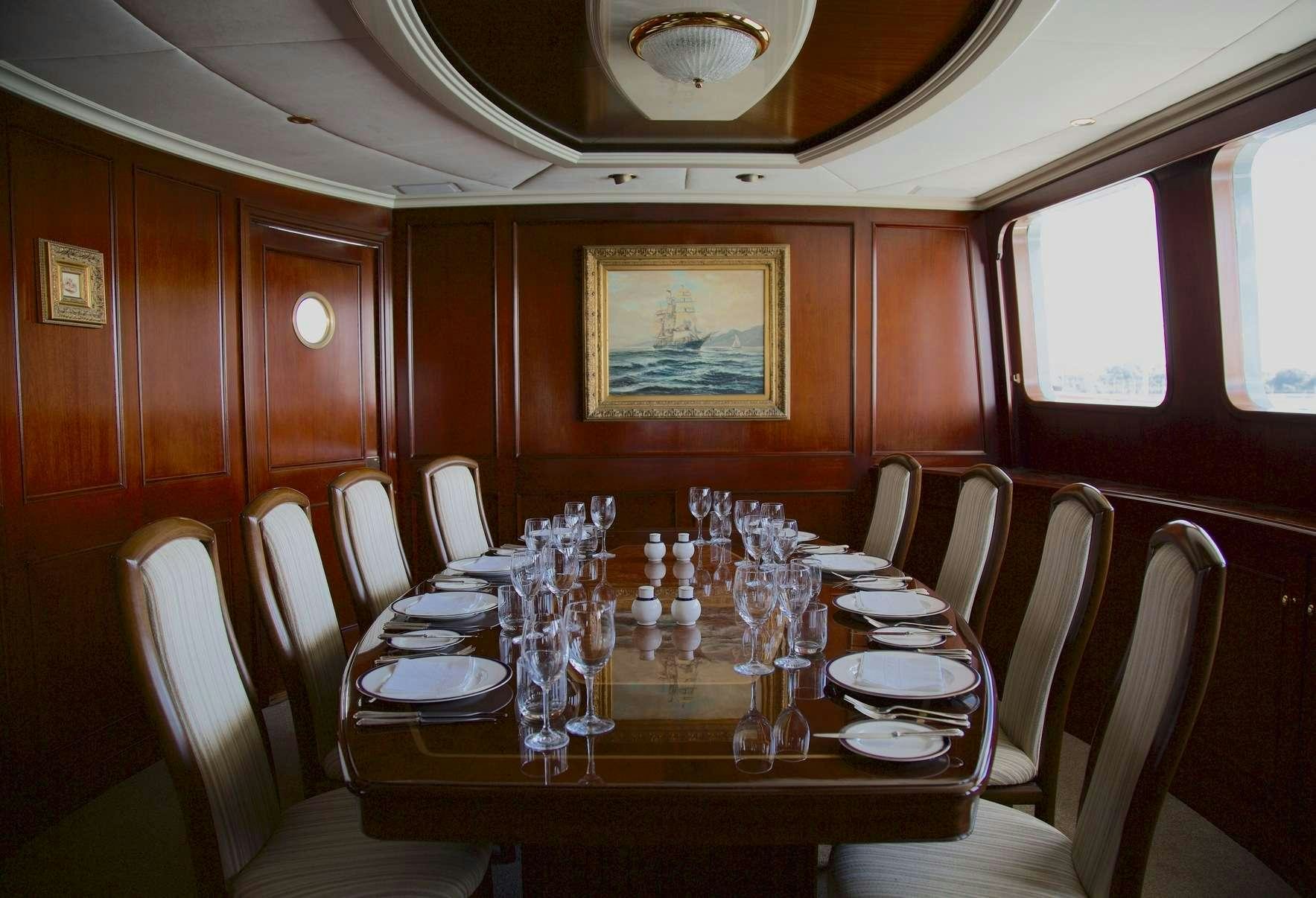 a dining table in a train aboard PACIFIC MERMAID Yacht for Charter