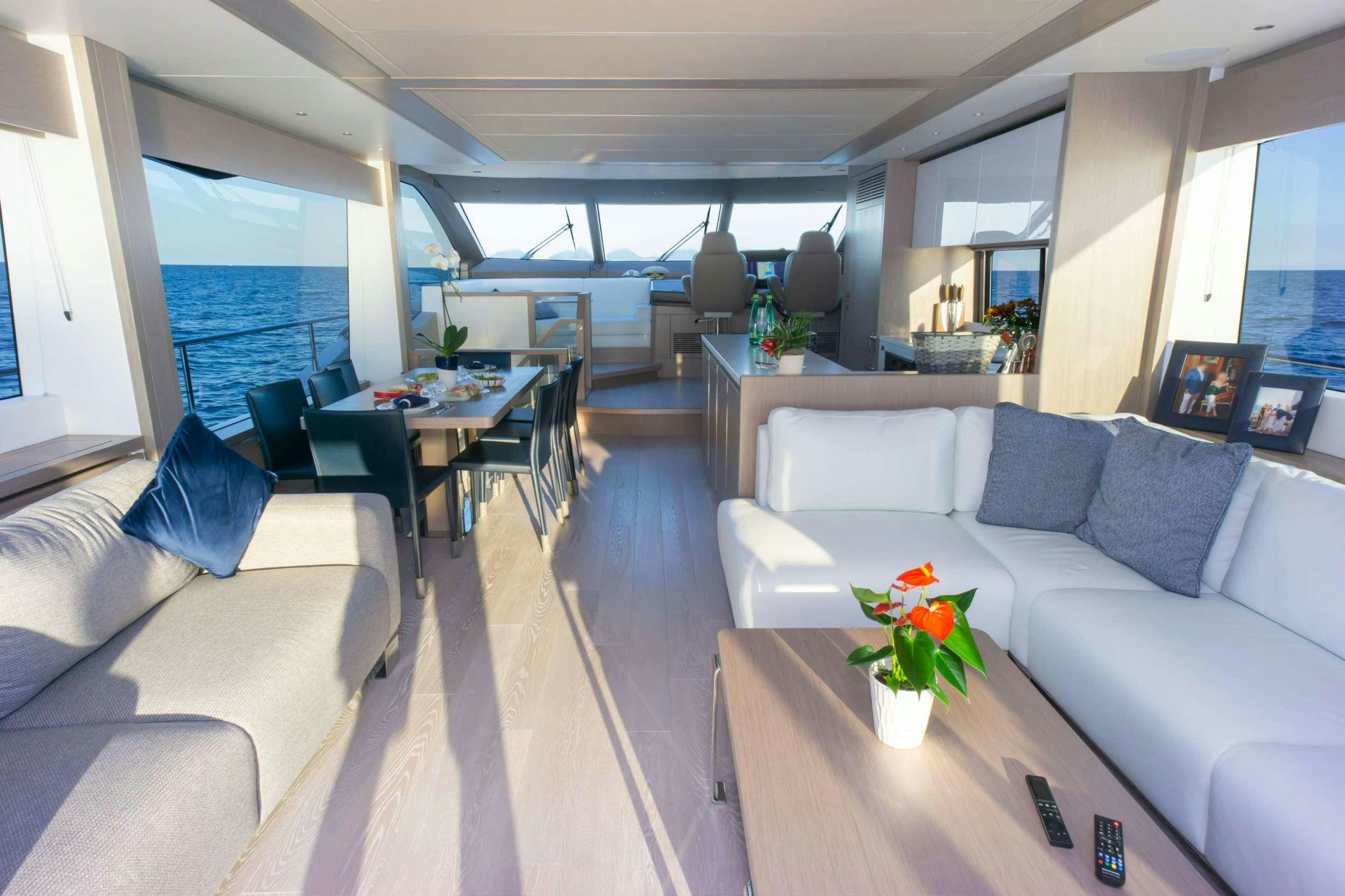 a living room with a couch and a table aboard MILAMO Yacht for Charter