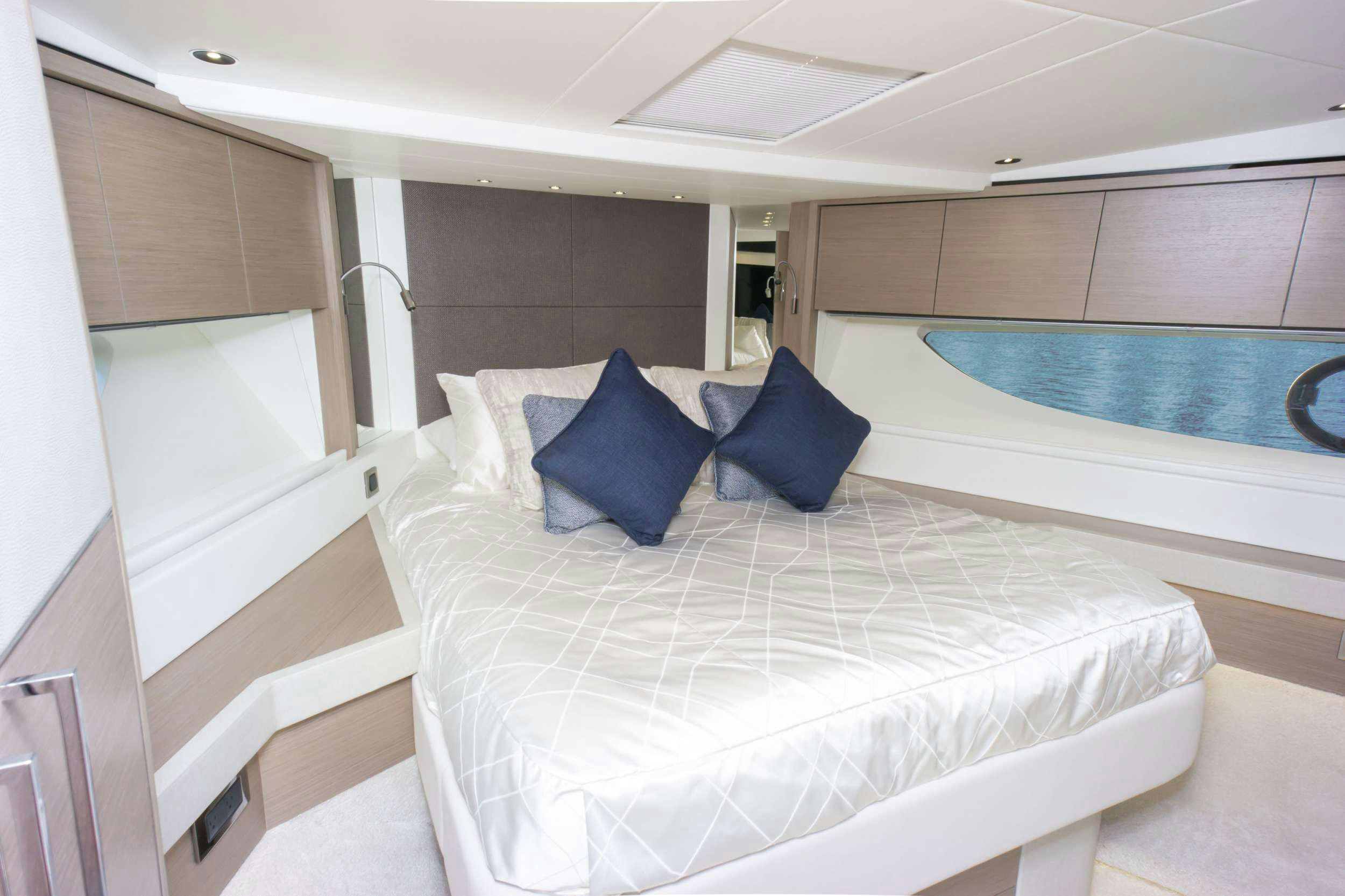a bed in a room aboard MILAMO Yacht for Charter