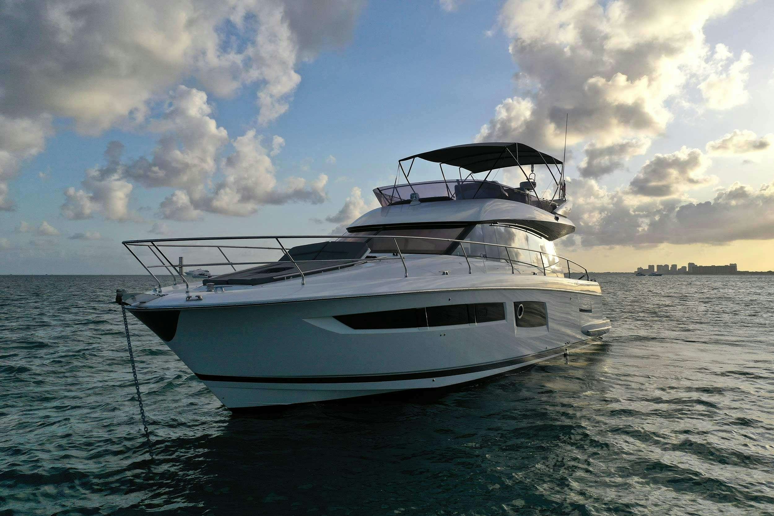 a white boat in the water aboard Patinga, Fort Lauderdale Yacht for Charter