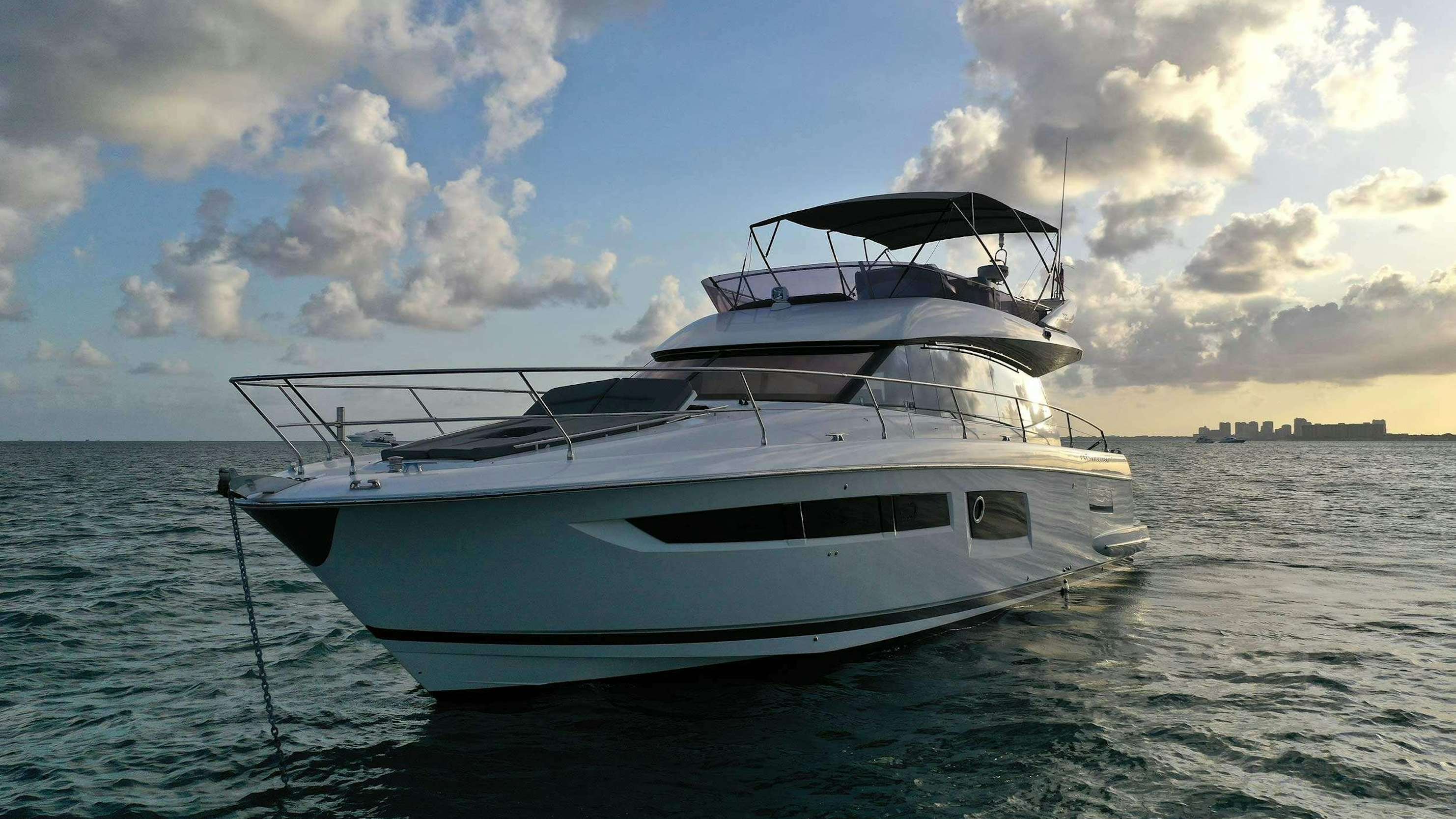a white boat in the water aboard Patinga, Fort Lauderdale Yacht for Charter