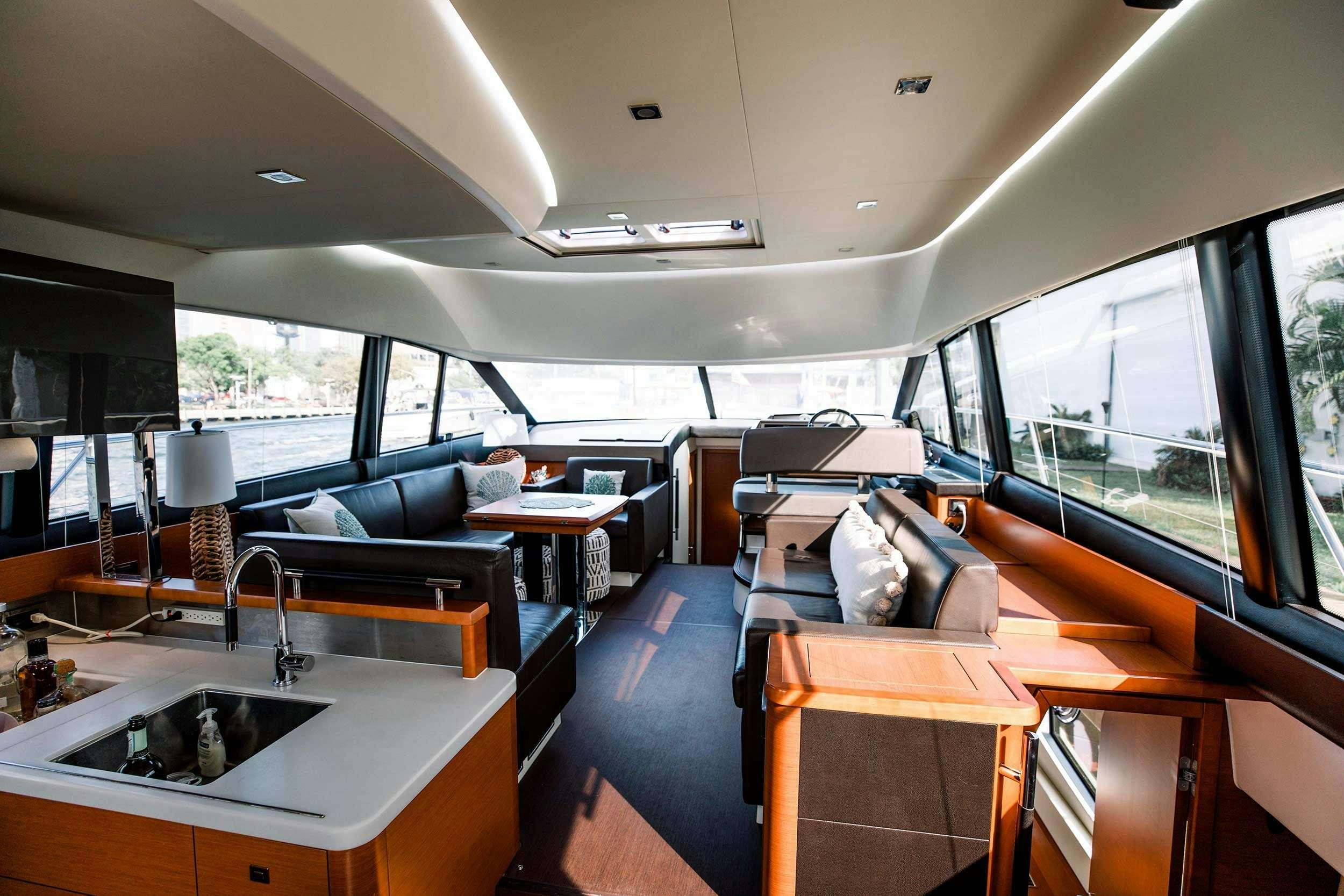 a room with a sink and a couch aboard Patinga, Fort Lauderdale Yacht for Charter