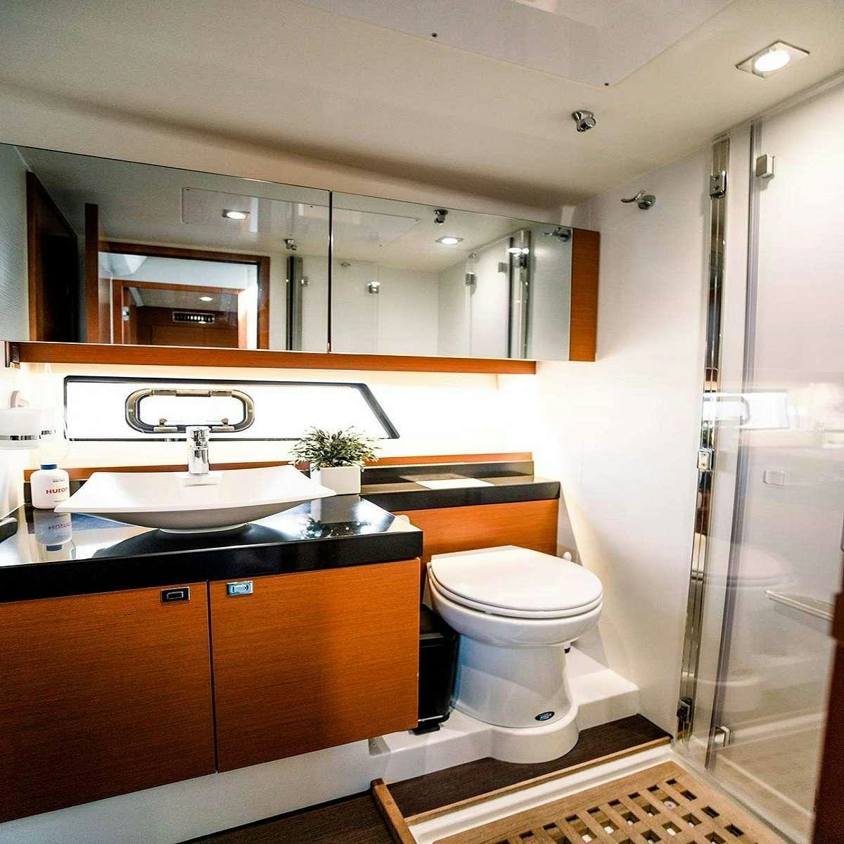 a bathroom with a sink and a toilet aboard Patinga, Fort Lauderdale Yacht for Charter
