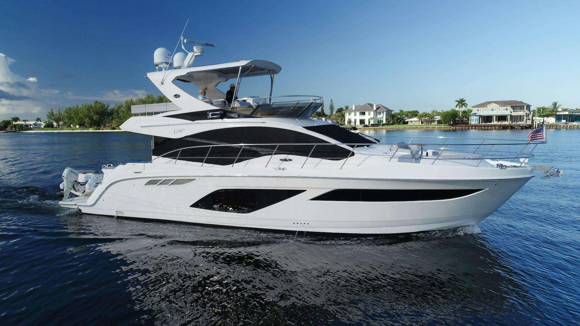 a white yacht on the water aboard ISLANDER Yacht for Charter