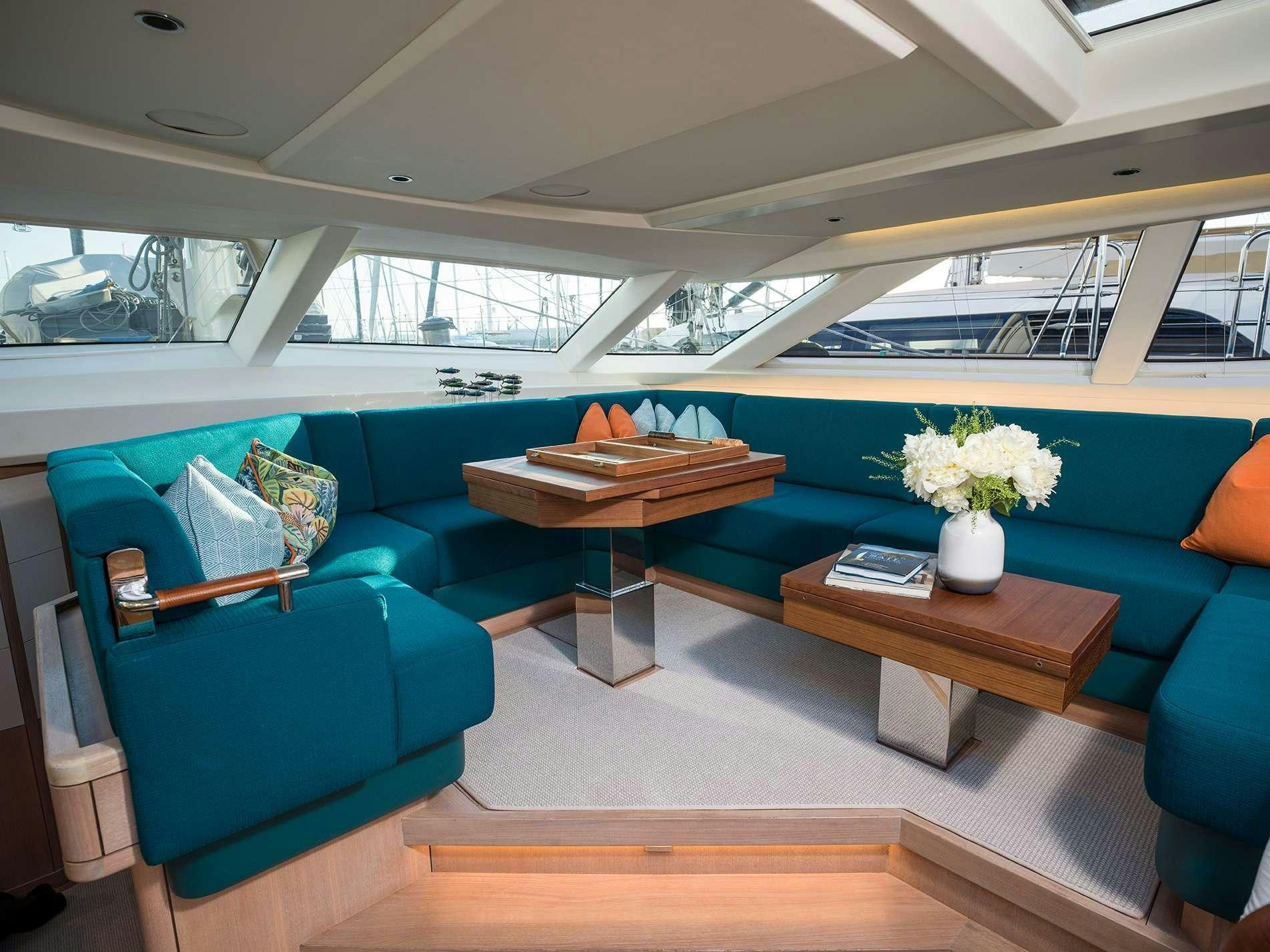 a room with a table and chairs aboard KARIBU Yacht for Charter