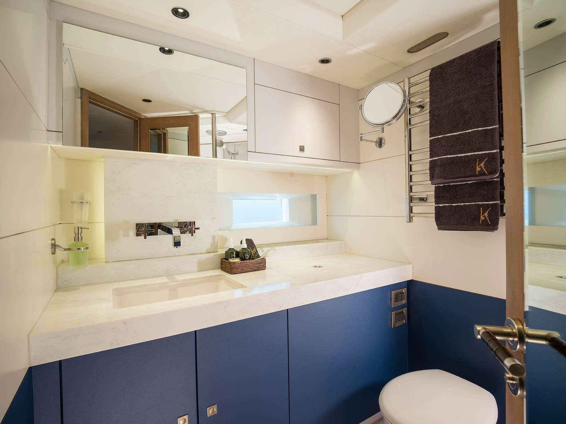a bathroom with a sink and a toilet aboard KARIBU Yacht for Charter